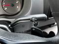Close-up of the gear shift mechanism in a 2019 Mercedes-Benz Sprinter featuring drive reverse neutral and park positions