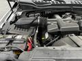 A close-up view of the engine compartment of a 2017 Ford F-250 showcasing the air intake system and battery with visible components and hoses
