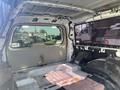 Interior view of a 2013 Ford Expedition with stripped down cargo area showing the floor and walls without any upholstery or seating