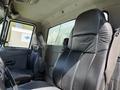 Interior of a 2009 International 7500 featuring two black leather seats with the word "Legacy" on the driver's seat
