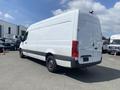 A 2024 Mercedes-Benz Sprinter van with a white exterior and gray accents parked in a lot