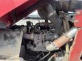 A close-up view of the engine compartment of a 2014 Toro Groundmaster 5910 showing various engine components and tubing