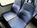 Two blue textured seats designed for a 2019 Chevrolet Express with a simple design and no visible armrests