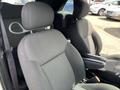 The front seats of a 2005 Chrysler PT Cruiser with fabric upholstery and headrests