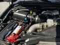 A 2008 Ford F-550 engine bay showing various components including the air intake system battery and hoses
