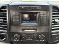 Dashboard of a 2018 Ford F-150 featuring a modern audio system with a display screen and various control buttons for radio and settings
