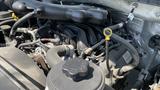 Close-up view of the engine compartment of a 2019 Ford F-550 showing the various engine components and hoses