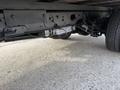 A 2020 Ford F-550 chassis showcasing its undercarriage including the differential and suspension components