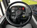 A 2009 Spartan Gladiator steering wheel and dashboard with various gauges and controls visible