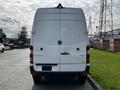 2017 Mercedes-Benz Sprinter van viewed from the rear with a white exterior and the Mercedes-Benz logo prominently displayed on the back doors