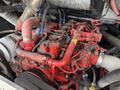 A close-up view of the engine of a 2018 Grande West Vicinity featuring numerous red components pipes and wires