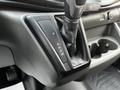 Close-up of the gear shift of a 2020 Ford Transit showing the park reverse neutral drive and manual options