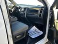 Interior of a 2014 RAM 5500 showing the driver's seat dashboard and center console with floor mats