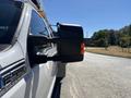 A 2016 Ford F-550 truck with a side mirror visible in the foreground