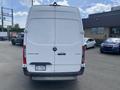 A white 2022 Mercedes-Benz Sprinter cargo van seen from the rear with the model name and logo visible on the back door