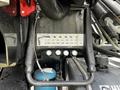 Close-up of the control panel and hydraulic components on a 2017 International WorkStar 7600 featuring pressure gauges and connectors