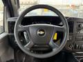 Steering wheel of a 2020 Chevrolet Express with the Chevy logo visible in the center and controls on the side