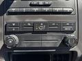 Dashboard controls of a 2014 Ford F-250 SD featuring air conditioning and fan settings
