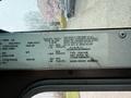 A 2012 Ford Econoline vehicle information label showing specifications for tire pressure and other details