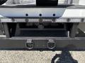 A 2016 Ford F-550 rear view showing the hitch area with multiple LED lights and mounting brackets
