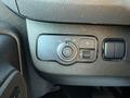 The interior controls of a 2023 Mercedes-Benz Sprinter featuring buttons for headlights fog lights and auto settings