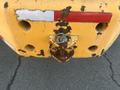 Rear view of a 2013 JCB 510-56 Loadall showing a rusty towing hitch and worn yellow paint with visible damage and old reflective tape