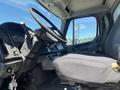 Interior of a 2007 Freightliner M2 106 showing the driver's seat steering wheel and control panel