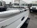 A white 2017 Ford F-250 SD truck bed with visible dents and scratches