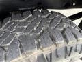 Close-up of the textured tread of a tire from a 2016 GMC Sierra 1500 showing prominent grooves and patterns designed for traction