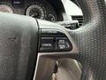 The image shows the steering wheel and cruise control buttons of a 2014 Honda Odyssey including buttons for cruise cancel and acceleration settings
