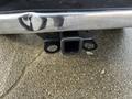 Hitch receiver attached to the rear of a 2015 RAM 1500 truck