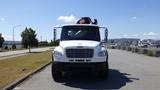 A white 2017 Freightliner M2 106 truck with a front-mounted plow attachment and an orange light on the roof