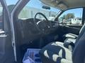Interior of a 2007 Chevrolet Express with a driver's seat view dashboard steering wheel and console area