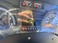 A 2012 Ford Econoline dashboard displaying gauges and digital readings including trip distance and odometer at 244210 miles