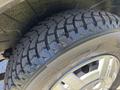 Close-up of a treaded tire on a 2016 RAM Promaster showing detailed patterns and grooves for traction