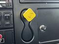 A yellow parking brake release handle labeled Bendix located on the dashboard of a 2017 International WorkStar 7600