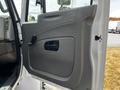 The interior door panel of a 2019 International 4300 featuring a handle and a window control switch