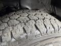 Close-up of a worn tire tread from a 2020 Chevrolet Express showing detailed patterns and grooves designed for traction