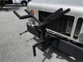 A modified front hitch with multiple mounting arms attached to the front of a 2008 Morgan Olson Workhorse vehicle