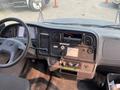 Interior view of a 2007 Freightliner B2 showing the dashboard with gauges a radio panel and various control buttons