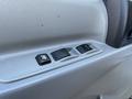 Close-up of the control panel in a 2014 Hino 195 featuring buttons for window adjustments and a lock mechanism