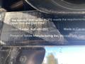 A close-up of a metal plaque on a 2010 Kubota F3680 showing the model name and serial number as well as manufacturer details
