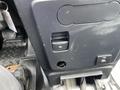 A control panel featuring a power outlet and a USB port located on the center console of a 2021 Ford Explorer