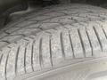 Close-up of a worn tire tread from a 2018 Buick Encore showing distinct grooves and patterns indicating usage and wear on the surface