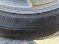 A close-up view of a 2013 Ford Expedition tire showing detailed tread patterns and tire specifications including size and branding