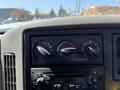 Dashboard controls of a 2009 International 7500 showing climate settings and a radio unit