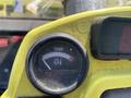 Close-up of a temperature gauge from a 2010 Kubota F3680 showing a needle pointing towards the red warning zone