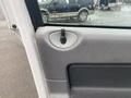 Close-up of the interior door handle and window control of a 2008 Dodge Ram 5500