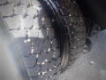 A close-up of a tire from a 2016 International WorkStar 7500 showcasing a rugged tread design suitable for heavy-duty vehicles