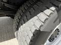 Close-up of a tire from a 2018 Hino 195 showcasing its tread pattern and surface texture